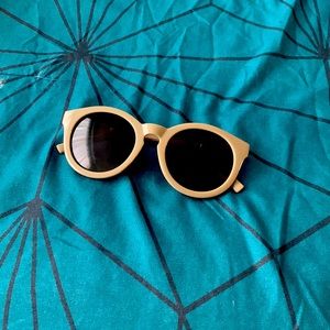 Forever 21 sunglasses, brown lenses, tan frame with a silver design on the sides